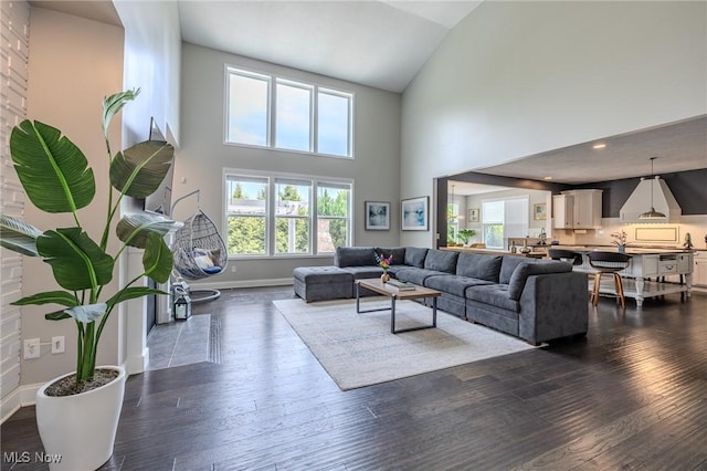 443 S Hametown Rd, Copley, OH 44321 - living area with baseboards, dark wood finished floors, high vaulted ceiling, and recessed lighting