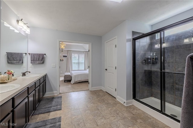 443 S Hametown Rd, Copley, OH 44321 - ensuite bathroom featuring double vanity, a shower stall, and baseboards