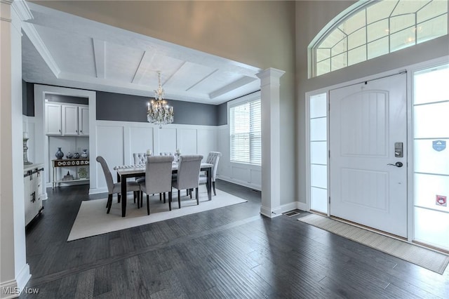 443 S Hametown Rd, Copley, OH 44321 - entryway featuring a chandelier, dark wood-type flooring, a wainscoted wall, a decorative wall, and ornate columns