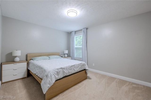 443 S Hametown Rd, Copley, OH 44321 - bedroom featuring light colored carpet, a textured ceiling, and baseboards