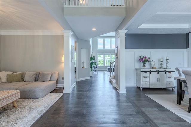 443 S Hametown Rd, Copley, OH 44321 - living area with decorative columns, dark wood finished floors, a towering ceiling, baseboards, and recessed lighting