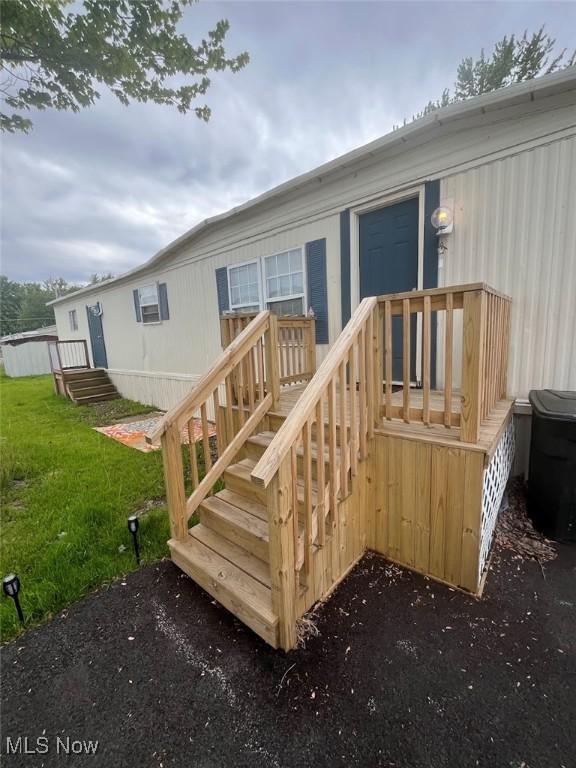 107 Marilyn Dr, Madison, OH 44057 - deck featuring a yard