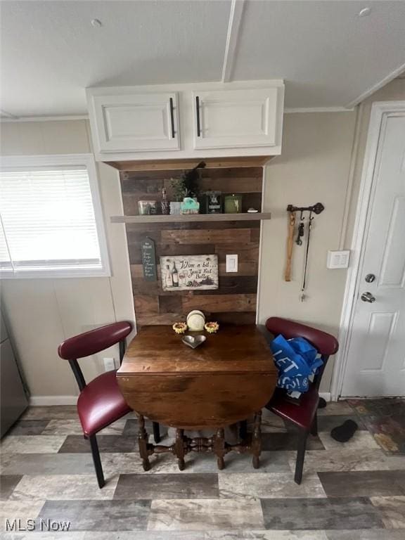 107 Marilyn Dr, Madison, OH 44057 - dining space featuring crown molding