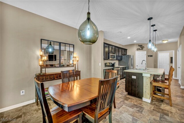 713 Westpointe Dr, Amherst, OH 44001 - dining space featuring baseboards