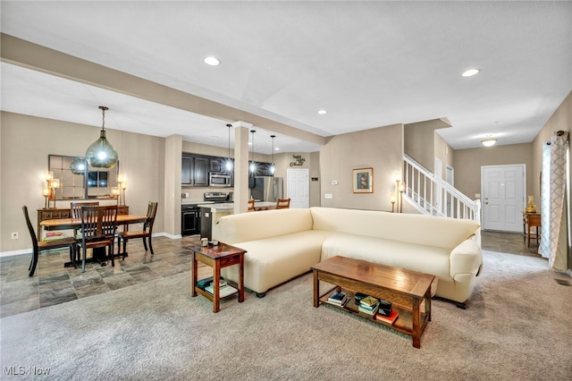 713 Westpointe Dr, Amherst, OH 44001 - carpeted living area with stairs, baseboards, and recessed lighting