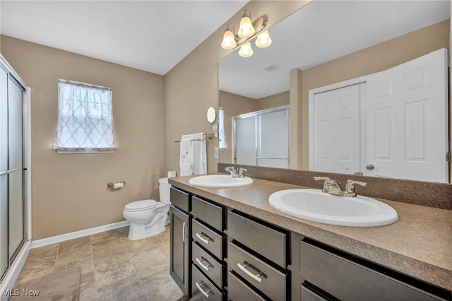713 Westpointe Dr, Amherst, OH 44001 - full bath with baseboards, double vanity, a stall shower, and toilet