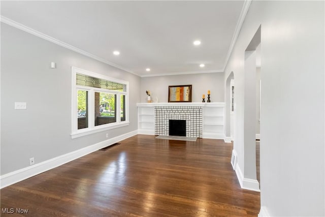 3566 Ludgate Rd, Shaker Heights, OH 44120 - unfurnished living room featuring wood finished floors, ornamental molding, arched walkways, baseboards, and recessed lighting