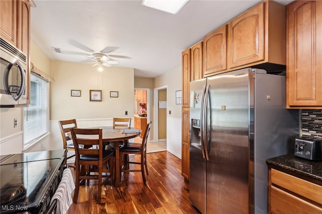 153 N Doan Ave, Painesville, OH 44077 - dining area featuring dark wood-type flooring and a ceiling fan