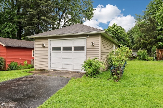 153 N Doan Ave, Painesville, OH 44077 - detached garage featuring asphalt driveway