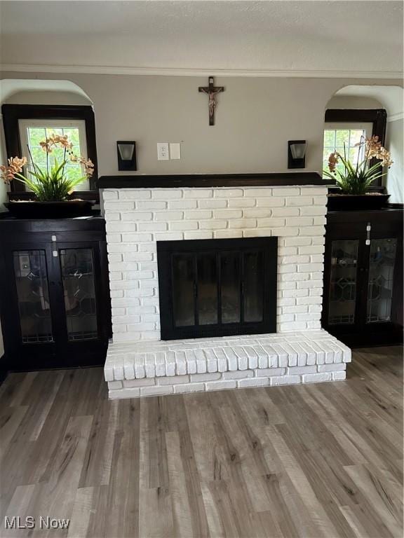 16112 Raymond St, Maple Heights, OH 44137 - detailed view of a brick fireplace and wood finished floors