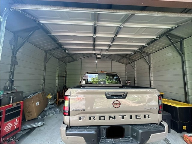 16112 Raymond St, Maple Heights, OH 44137 - garage featuring metal wall and a garage door opener
