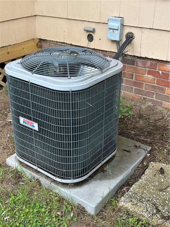 16112 Raymond St, Maple Heights, OH 44137 - exterior view of central AC unit and crawl space