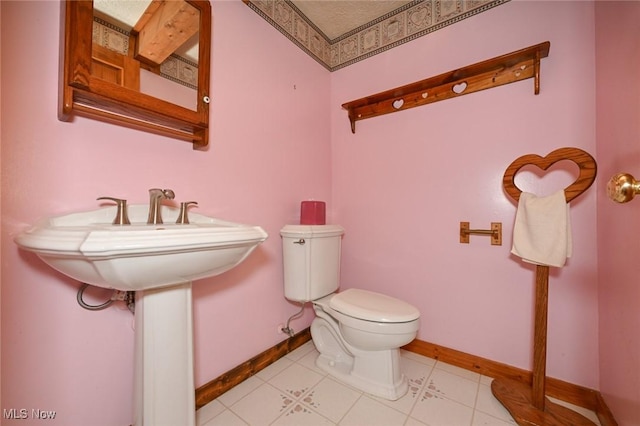 5360 Lance Rd, Medina, OH 44256 - half bath with toilet, baseboards, and tile patterned floors