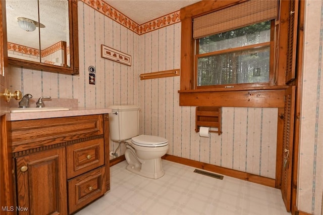 5360 Lance Rd, Medina, OH 44256 - half bathroom with tile patterned floors, vanity, toilet, and baseboards