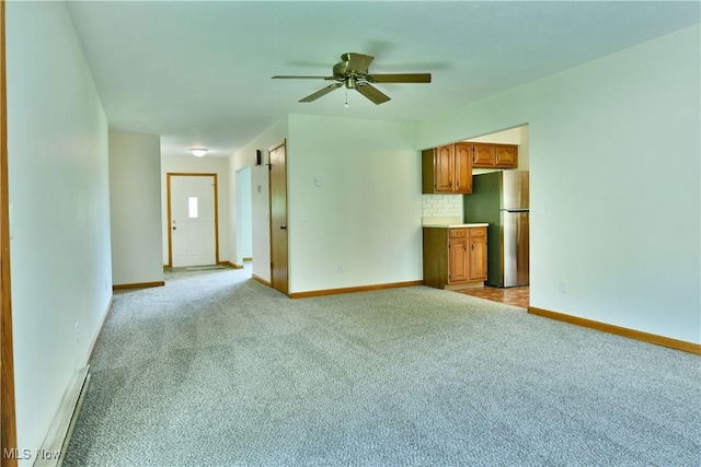 5990 Stewart Sharon Rd, Hubbard, OH 44425 - unfurnished living room with light colored carpet and a ceiling fan