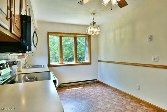 5990 Stewart Sharon Rd, Hubbard, OH 44425 - kitchen with a baseboard radiator, a sink, stainless steel microwave, ceiling fan, and baseboards
