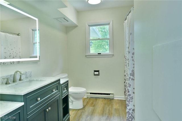 5990 Stewart Sharon Rd, Hubbard, OH 44425 - bathroom with a baseboard radiator, vanity, wood finished floors, and curtained shower