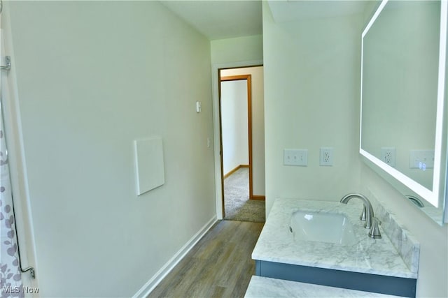 5990 Stewart Sharon Rd, Hubbard, OH 44425 - bathroom with vanity, wood finished floors, and baseboards
