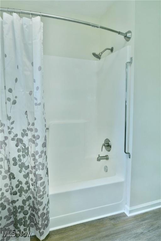 5990 Stewart Sharon Rd, Hubbard, OH 44425 - bathroom featuring shower / tub combo with curtain and wood finished floors