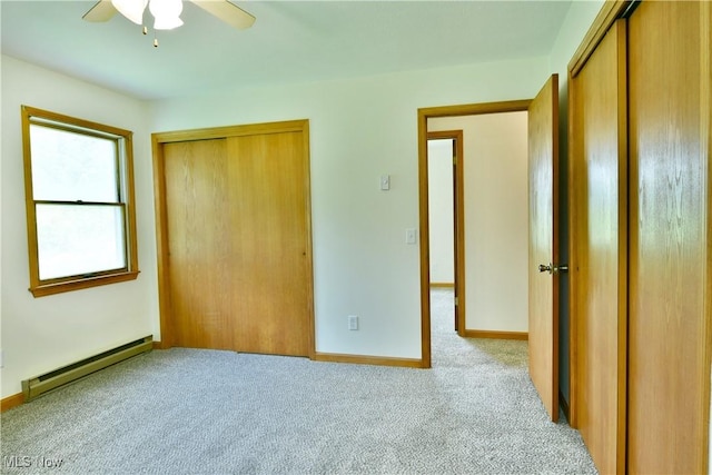 5990 Stewart Sharon Rd, Hubbard, OH 44425 - unfurnished bedroom featuring baseboard heating, carpet floors, baseboards, and ceiling fan