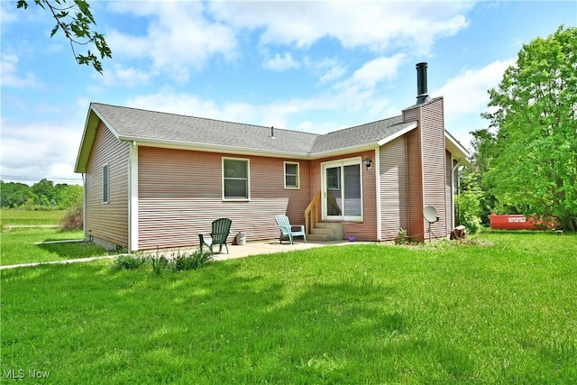 5990 Stewart Sharon Rd, Hubbard, OH 44425 - back of house with a patio, a chimney, and a lawn