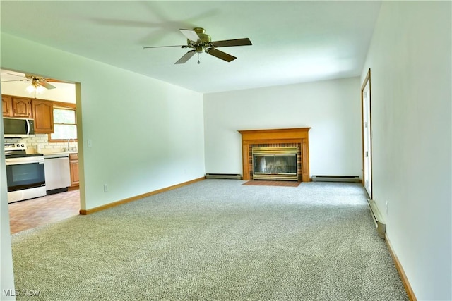 5990 Stewart Sharon Rd, Hubbard, OH 44425 - unfurnished living room with a baseboard heating unit, light carpet, ceiling fan, and a brick fireplace