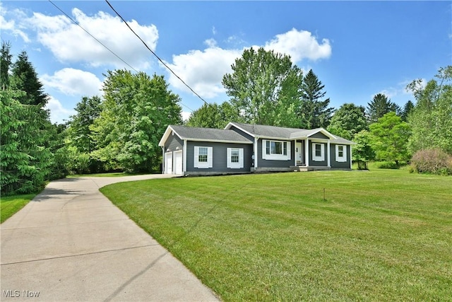 5990 Stewart Sharon Rd, Hubbard, OH 44425 - single story home featuring concrete driveway, a front lawn, and an attached garage