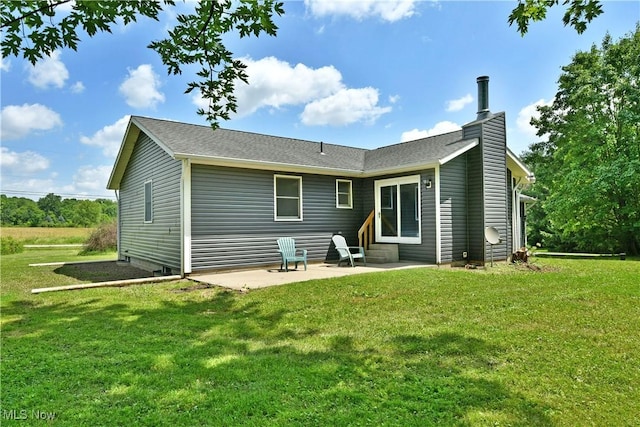 5990 Stewart Sharon Rd, Hubbard, OH 44425 - back of property with a patio, a yard, and a chimney