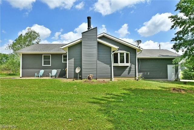 5990 Stewart Sharon Rd, Hubbard, OH 44425 - rear view of house with a yard, a chimney, and a patio