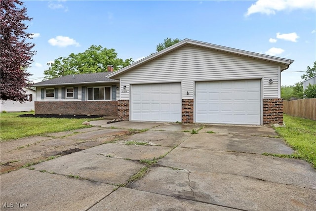 6265 Jaycox Rd, North Ridgeville, OH 44039 - single story home featuring brick siding, driveway, and a garage