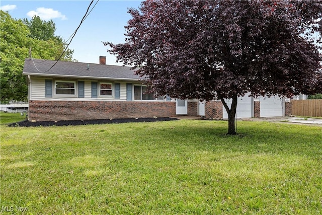 6265 Jaycox Rd, North Ridgeville, OH 44039 - view of front of house featuring brick siding, a chimney, and driveway