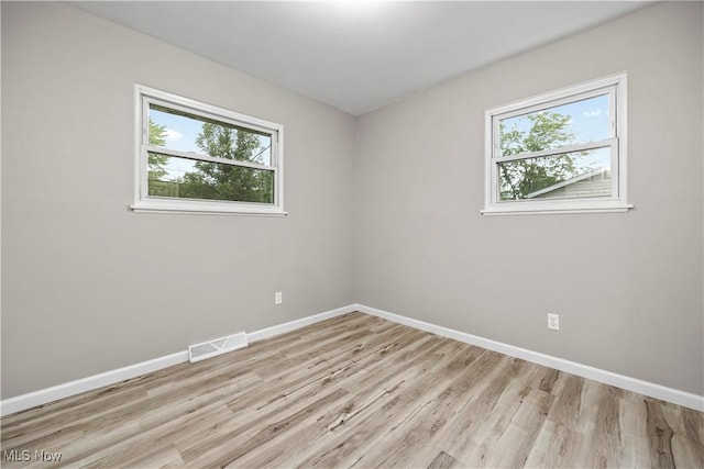 6265 Jaycox Rd, North Ridgeville, OH 44039 - empty room with plenty of natural light, baseboards, and light wood-style flooring