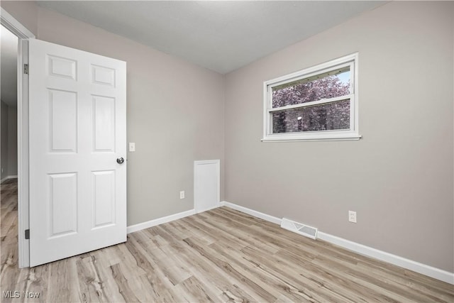 6265 Jaycox Rd, North Ridgeville, OH 44039 - empty room with light wood-style floors and baseboards