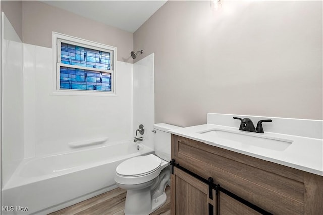 6265 Jaycox Rd, North Ridgeville, OH 44039 - bathroom featuring vanity, toilet, shower / bath combination, and wood finished floors