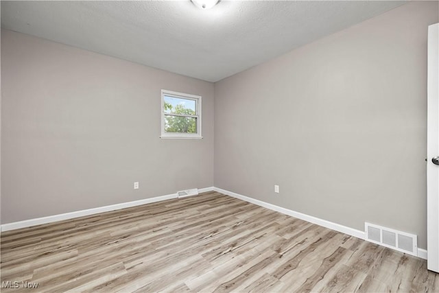 6265 Jaycox Rd, North Ridgeville, OH 44039 - spare room featuring light wood finished floors and baseboards
