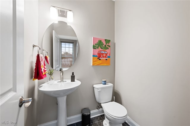 1343 W Clifton Blvd, Lakewood, OH 44107 - half bath featuring baseboards, toilet, and tile patterned flooring