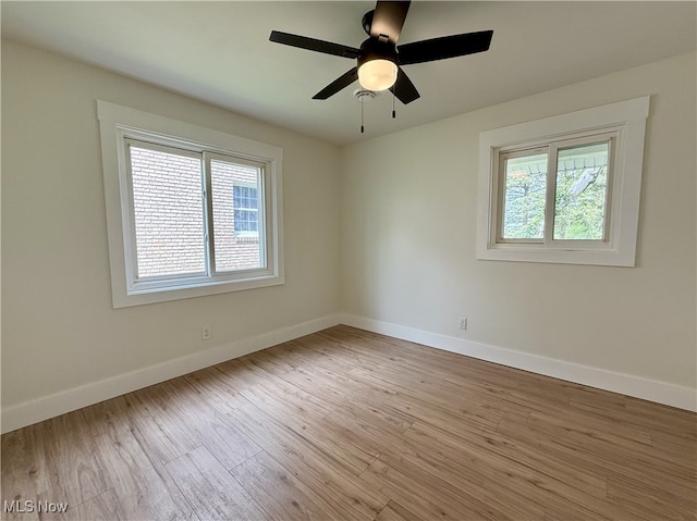 6250 W Liberty St, Hubbard, OH 44425 - unfurnished room with wood finished floors, baseboards, and a ceiling fan
