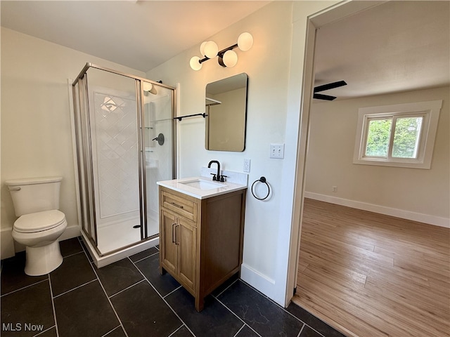 6250 W Liberty St, Hubbard, OH 44425 - bathroom featuring vanity, a shower stall, toilet, baseboards, and tile patterned floors