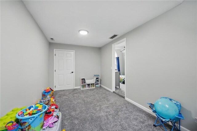 301 Tower Ln, Amherst, OH 44001 - playroom with carpet floors and baseboards