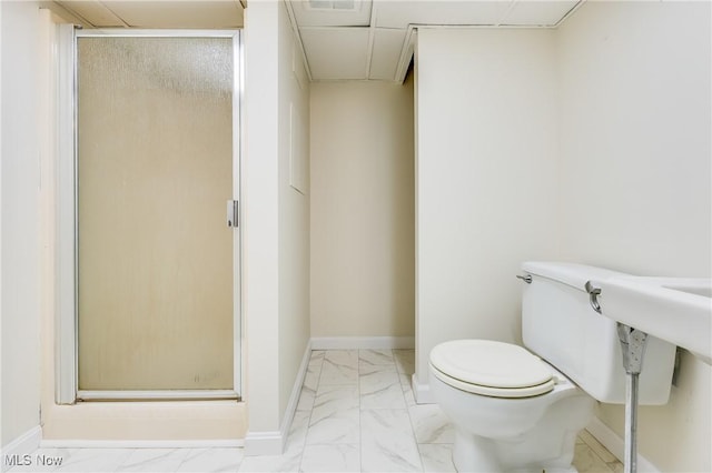 2546 Atlantic, Warren, OH 44483 - bathroom featuring marble look tiles, a shower stall, toilet, and baseboards