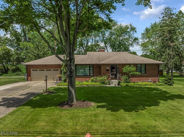 1033 Briarcliff Ave, Alliance, OH 44601 - ranch-style home featuring brick siding, a garage, and a front yard