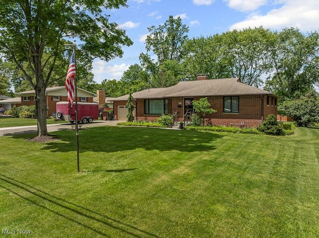 1033 Briarcliff Ave, Alliance, OH 44601 - ranch-style house featuring an attached garage, brick siding, driveway, a front lawn, and a chimney