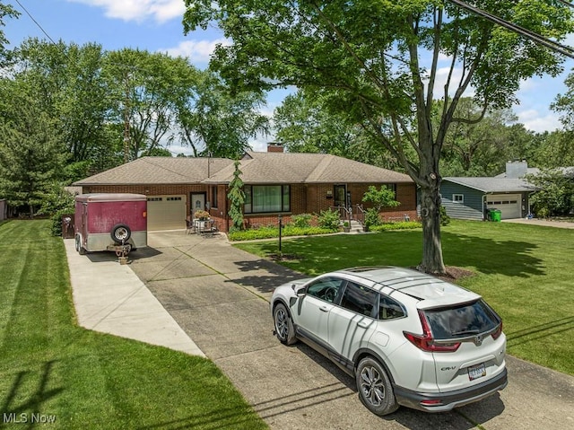 1033 Briarcliff Ave, Alliance, OH 44601 - ranch-style home featuring an attached garage, driveway, a front lawn, and brick siding