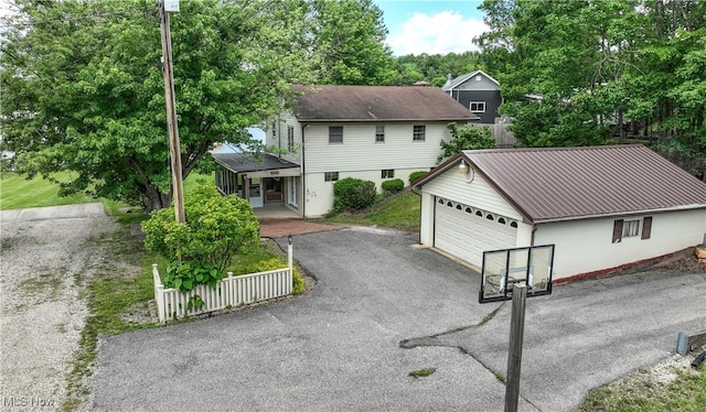 58429 Lashley Rd, Senecaville, OH 43780 - view of front of house with a garage, an outdoor structure, and metal roof