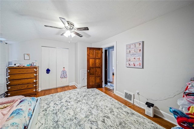 3906 Redfern Rd, Parma, OH 44134 - bedroom with wood finished floors, baseboards, a closet, and ceiling fan