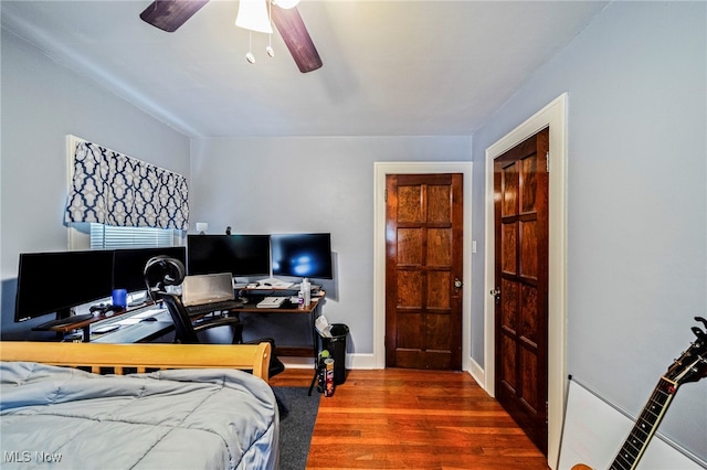 3906 Redfern Rd, Parma, OH 44134 - bedroom with wood finished floors, ceiling fan, a desk, and baseboards