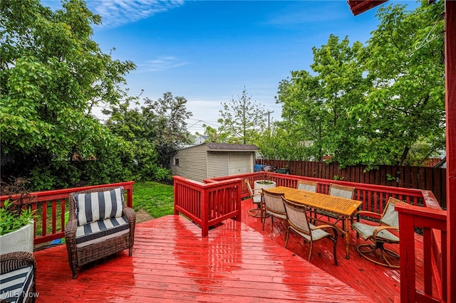 3906 Redfern Rd, Parma, OH 44134 - wooden deck featuring an outbuilding, a fenced backyard, outdoor dining area, and outdoor lounge area