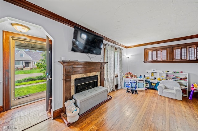 3906 Redfern Rd, Parma, OH 44134 - living area with ornamental molding, wood finished floors, and a fireplace