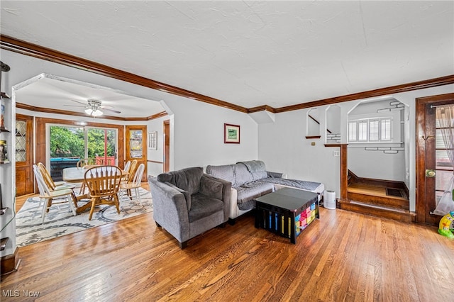 3906 Redfern Rd, Parma, OH 44134 - living area featuring wood-type flooring, ceiling fan, crown molding, stairway, and baseboards