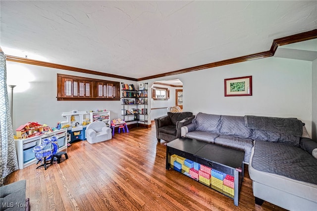 3906 Redfern Rd, Parma, OH 44134 - living room featuring arched walkways, ornamental molding, and wood finished floors